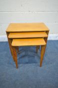 A MID CENTURY GORDON RUSSELL TEAK NEST OF THREE TABLES, largest table width 61cm depth 31cm x height