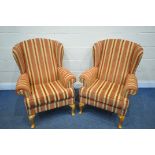 A PAIR OF RED STRIPPED WING BACK ARMCHAIRS, on beech legs (condition report: good)