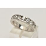 A WHITE METAL, DIAMOND HALF ETERNITY RING, channel set with ten round brilliant cut diamonds,