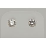 A PAIR OF 18CT WHITE GOLD DIAMOND STUD EARRINGS, each round brilliant cut diamond in a six claw