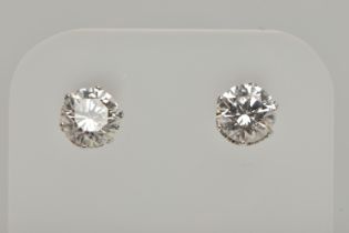 A PAIR OF 18CT WHITE GOLD DIAMOND STUD EARRINGS, each round brilliant cut diamond in a six claw