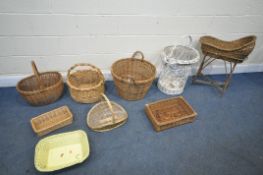 A SELECTION OF WICKER BASKETS, to include a crib on stand, five handled baskets, etc (condition