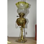 AN ARTS & CRAFTS BRASS AND COPPER OIL LAMP IN THE STYLE OF W.A.S. BENSON, the frilled green and