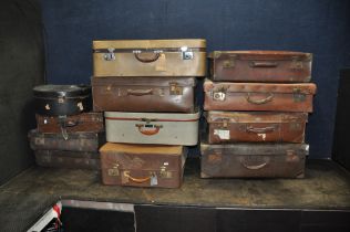 TWELVE ITEMS OF VINTAGE LUGGAGE including eight fibre suitcases, a tweed and leatherette 'Watajoy'