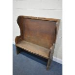 AN OAK HALL SETTLE, width 122cm x depth 48cm x height 131cm (condition report: alterations, worn