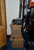 TWO WICKER FISHING BASKETS AND A GROUP OF VINTAGE FISHING RODS AND REELS, comprising two hinged