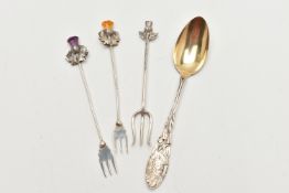 THREE PICKLE FORKS AND A SPOON, two silver Scottish pickle forks decorated with a thistle top,