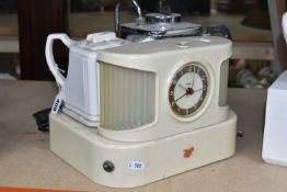 A GOBLIN TEASMADE, model D25, manufactured 1955-1960, the front with circular clock face, orange