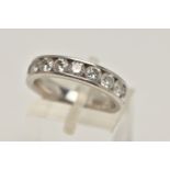 A PLATINUM DIAMOND HALF ETERNITY RING, channel set with ten round brilliant cut diamonds,