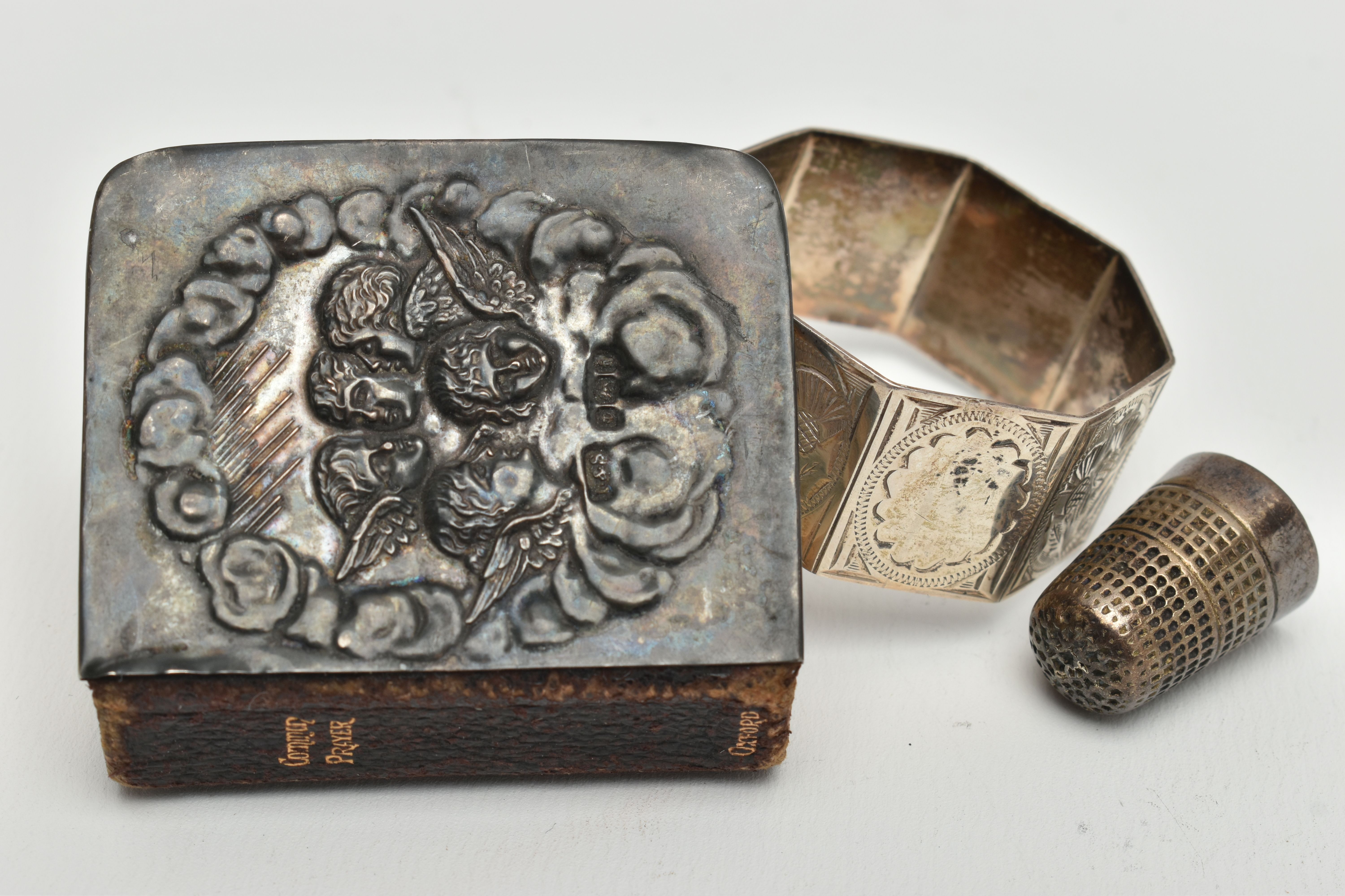 A MINIATURE BIBLE, THIMBLE AND A NAPKIN RING, silver embossed cherub front to the bible hallmarked - Image 3 of 3