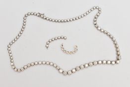 A DIAMOND LINE NECKLACE, designed as a row of graduated claw set, round brilliant cut diamonds,