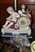 A LATE 19TH CENTURY MEISSEN PORCELAIN CLOCK CASE, modelled with a seated putto reading, arm