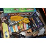 A BOX OF ASSORTED BOXED PUZZLES, BOARD GAMES, PUPPETS AND TOYS, including Monopoly Wizard of Oz,