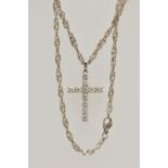 A WHITE METAL DIAMOND CROSS PENDANT AND A CHAIN, the cross pendant claw set with eleven round