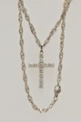 A WHITE METAL DIAMOND CROSS PENDANT AND A CHAIN, the cross pendant claw set with eleven round
