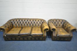A MUSTARD LEATHER TWO PIECE CHESTERFIELD LOUNGE SUITE, comprising a three seater settee, length