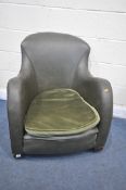 AN EARLY 20TH CENTURY GREEN LEATHERTTE ARMCHAIR, on casters (condition report: paint stain to the