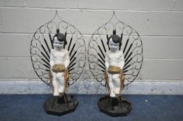 A PAIR OF MID 20TH CENTURY WROUGHT IRON AND PAINTED PLASTIC DECORATIVE FIGURAL ORNAMENTS, the