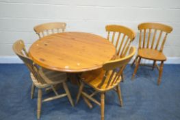 A MODERN PINE CIRCULAR PEDESTAL TABLE, diameter 106cm x height 73cm, and a five beech kitchen chairs