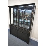 A BLACK FINISH GLAZED DISPLAY CABINET, with sliding doors, enclosing two glass shelves, over a