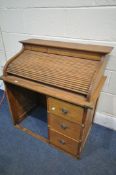 A SMALL MID CENTURY BEECH ROLL TOP DESK, with three drawers, width 78cm x depth 48cm x height