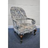 A VICTORIAN MAHOGANY ARMCHAIR, with a sprung reclining back, on front cabriole legs, and casters (