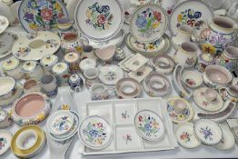 A QUANTITY OF POOLE POTTERY TRADITIONAL WARES, over sixty pieces of mainly floral painted pottery,