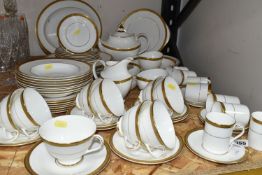ROYAL DOULTON 'ROYAL GOLD' DESIGN DINNERWARE, comprising nine cups (one chipped foot), seven saucers
