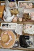 TWO BOXES OF REPRODUCTION DOLL MAKING ACCESSORIES, including nine bisque heads, a small quantity