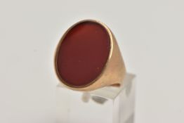 A 9CT GOLD LARGE SIGNET RING, a large oval carnelian set in a yellow gold mount, hallmarked 9ct