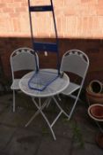 A WHITE PAINTED ALUMINUM THREE PIECE FOLDING BISTRO SET, comprising a circular table, diameter