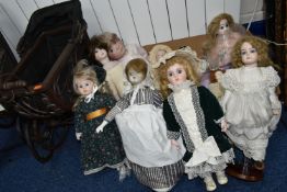 A BOX CONTAINING NINE REPRODUCTION BISQUE HEAD DOLLS, TOGETHER WITH TWO VICTORIAN STYLE DOLL'S