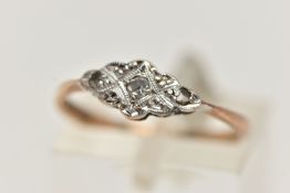 AN EARLY 20TH CENTURY GOLD RING, designed as an elongated scalloped central panel, set with a