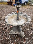 A SMALL LEAD WATER FEATURE, with a shell shaped bath, on a mythical creature base,