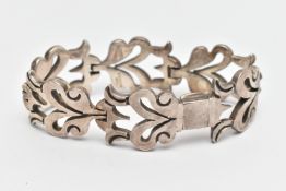 A HEAVY WHITE METAL BRACELET, abstract foliage design, fitted with an integrated folding box