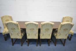 A REPRODUCTION OAK DRAW LEAF DINING TABLE, with two additional leaves, on twin turned supports,