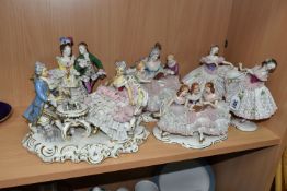 SIX DRESDEN FIGURES AND FIGURE GROUPS, each figure in a porcelain lace effect dress or with lace