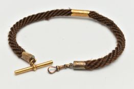 A LATE VICTORIAN WOVEN HAIR BRACELET, the woven hair bracelet with a central scallop edged spacer
