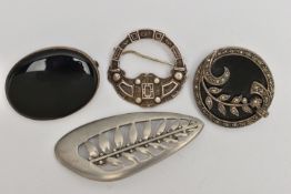 FOUR SILVER AND WHITE METAL BROOCHES, the first an oval onyx brooch with silver fittings, hallmarked