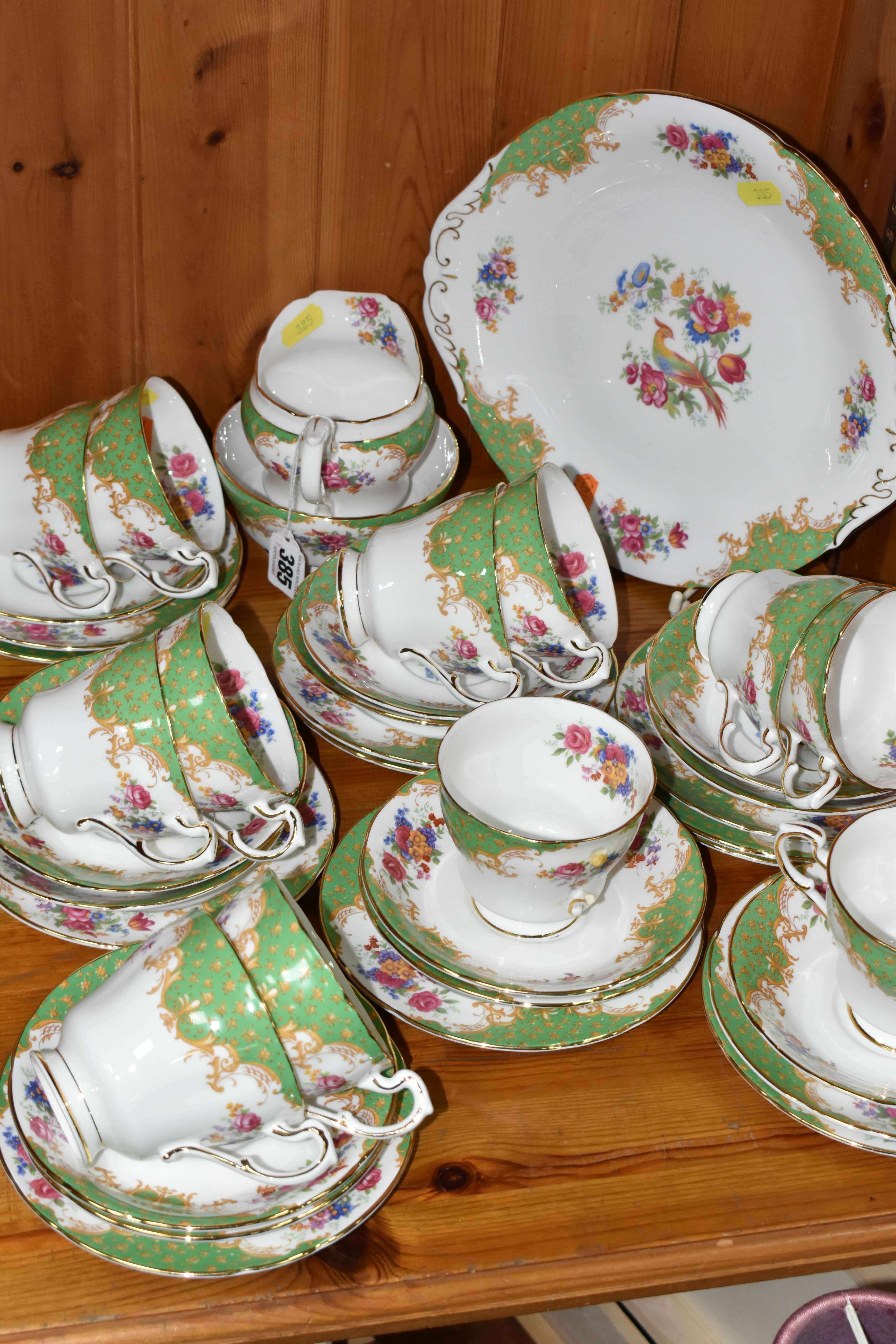 A PARAGON 'ROCKINGHAM' PATTERN TEA SET, comprising a cake plate, milk jug, twelve cups, twelve