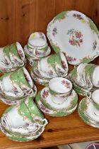 A PARAGON 'ROCKINGHAM' PATTERN TEA SET, comprising a cake plate, milk jug, twelve cups, twelve