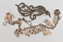 A CHARM BRACELET AND A BROOCH, the charm bracelet suspending eleven charms to include bagpipes,