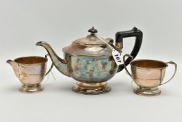A GEORGE VI SILVER THREE PIECE TEA SERVICE OF CIRCULAR FORM, the tea pot with Bakelite fittings, the