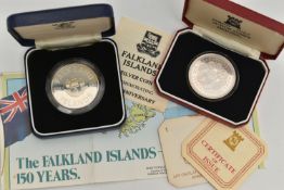 TWO CASED SILVER COINS, the first a Falkland Island 150th anniversary coin, an Tercentenary Crown