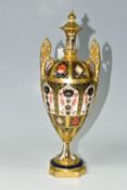 A ROYAL CROWN DERBY 'IMARI 1128 SOLID GOLD' BAND TWIN HANDLED VASE AND FIXED COVER, short pedestal