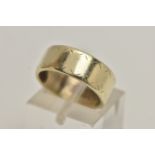 A YELLOW METAL BAND RING, a wide band ring with etched detail, approximate width 7mm, stamped 9ct,
