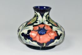 A MOORCROFT POTTERY POPPY PATTERN VASE, of squat bulbous form, with tube lined poppies on a dark