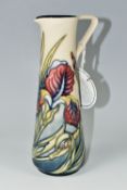 A MOORCROFT POTTERY 'IRIS' JUG, of slender form with angular handle, tube lined with pink, yellow