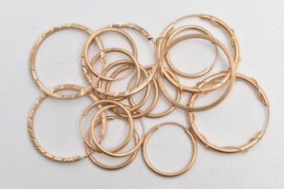 AN ASSORTMENT OF EIGHT PAIRS OF YELLOW METAL HOOP EARRINGS, hollow hoops with sleeper fittings,
