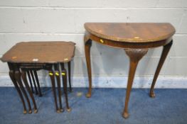 A WALNUT NEST OF THREE TABLES, along with a walnut demi lune hall table (condition report: surface